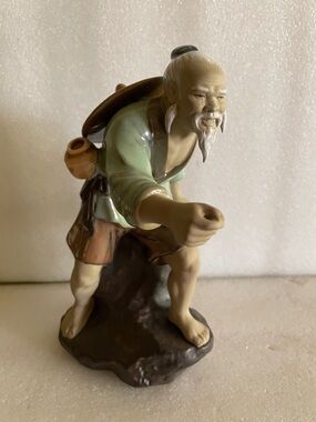 Hand-Painted Ceramic Elder Figurine in Green and Brown Glaze